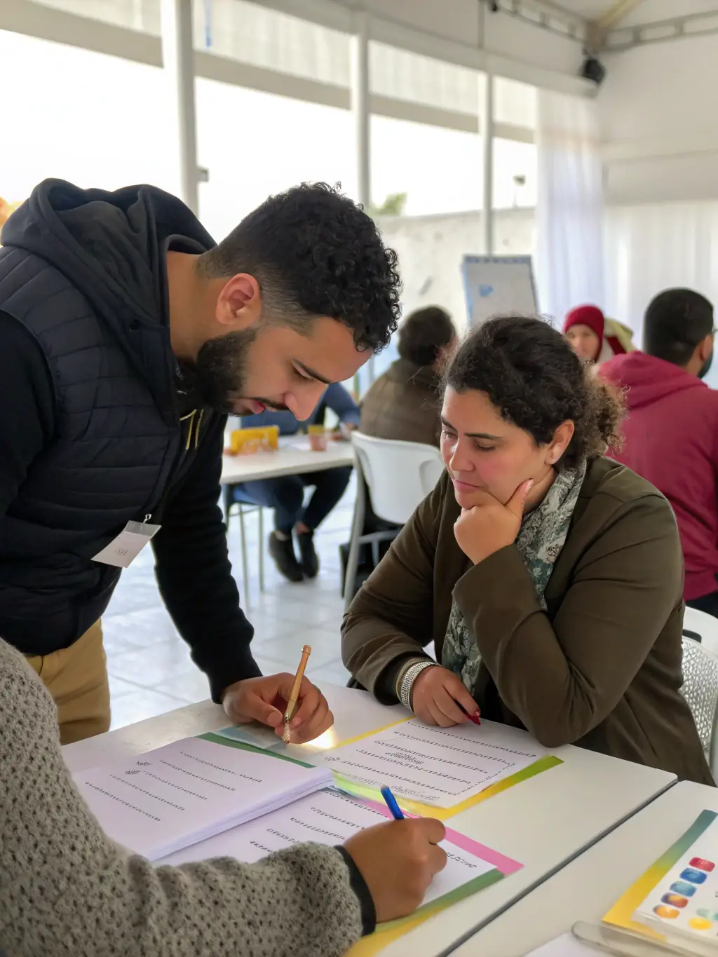 A workshop facilitator providing personalized feedback to a participant on their communication style, promoting self-awareness and continuous improvement.